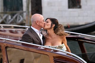 Bezos and Sánchez emerge for grand finale party as protests erupt: Live updates The bride and groom share a kiss for onlookers